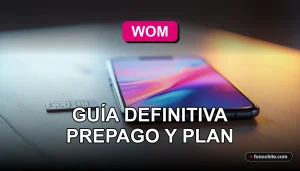 Smartphone WOM mostrando gráficos abstractos de colores, reposando sobre una mesa de madera clara junto a una tarjeta SIM.