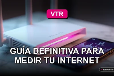 Medidor de velocidad de internet VTR mostrando gráficos de colores en una pantalla, junto a un router moderno sobre una mesa.